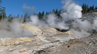 Mud holes, fumaroles, and geysers appear unexpectedly after several miles of dull trail in Yellowstone.