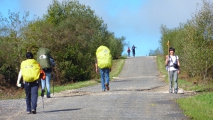 Pilgrims on El Camino Santiago. One Korean waiting for his partner. It's part of the many paved road walks that have little traffic.